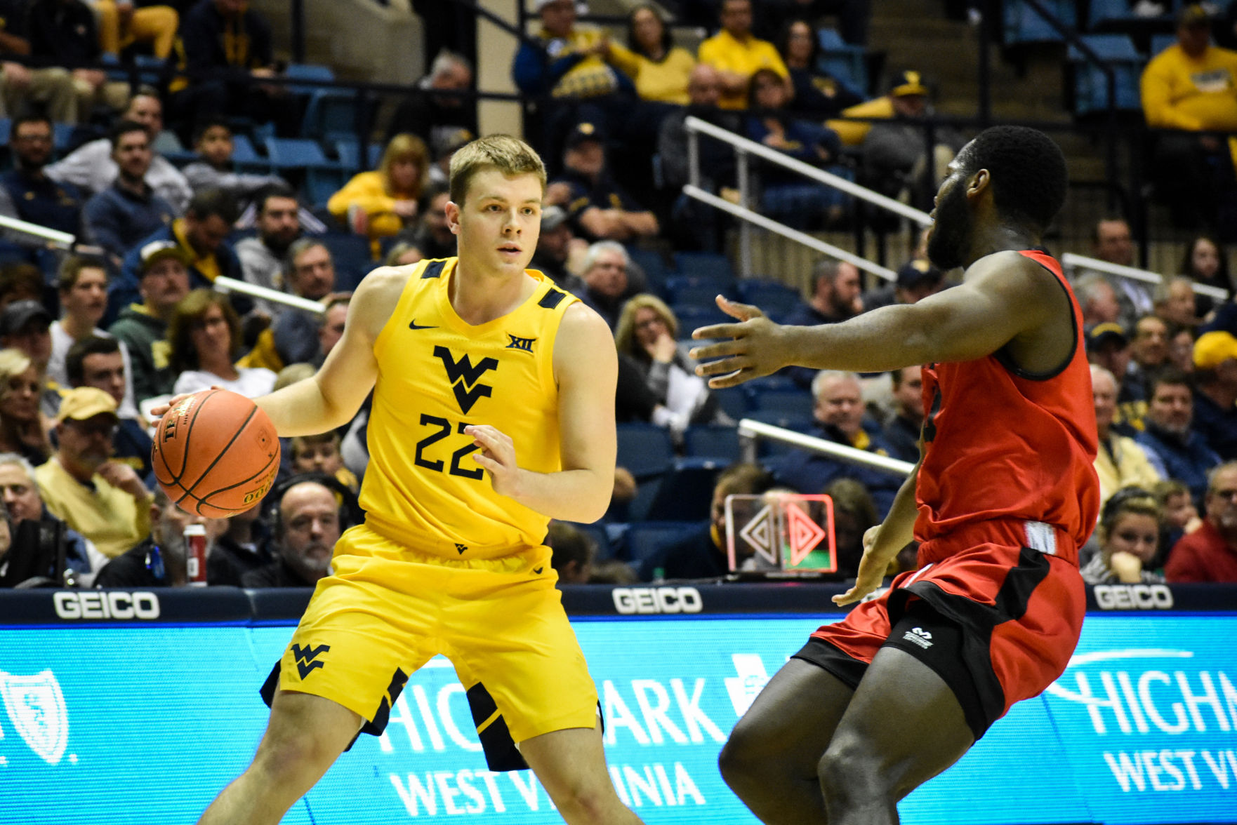 West Virginia guard Sean McNeil looks down the court for an open teammate against Austin Peay on Dec. 12, 2019 at the WVU Coliseum.